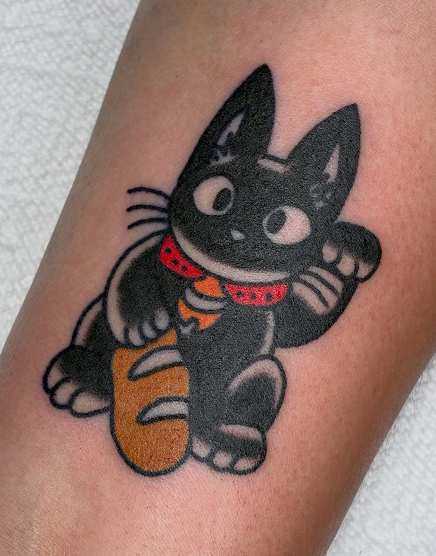 Cat American traditional tattoo on the forearm by Sav Robinson