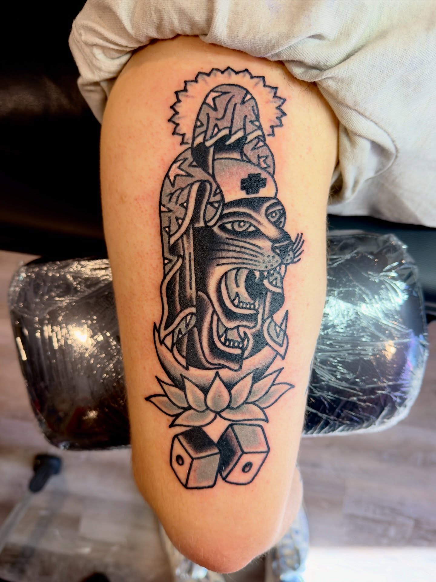 Panther with cross American traditional tattoo on the thigh by Jimmy Kelley