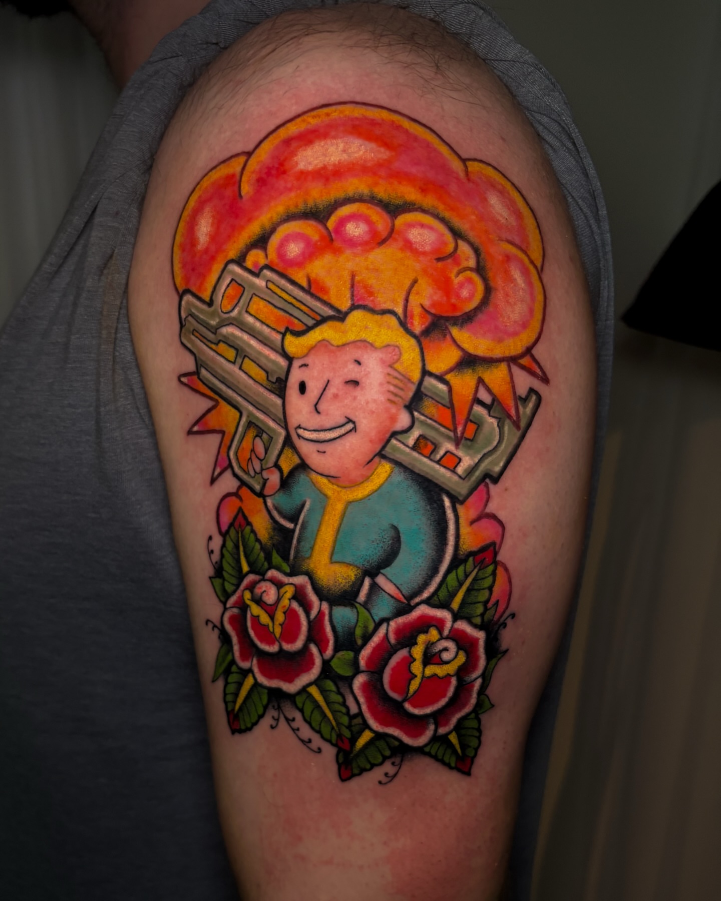 Vault Boy with Nuka-Cola American traditional tattoo on the upper arm by Sal