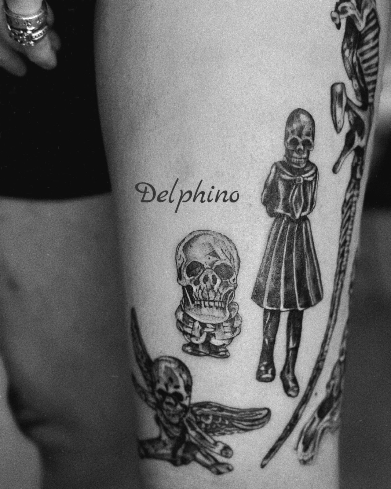 Skulls and skeleton black and grey tattoo on the forearm by MJ