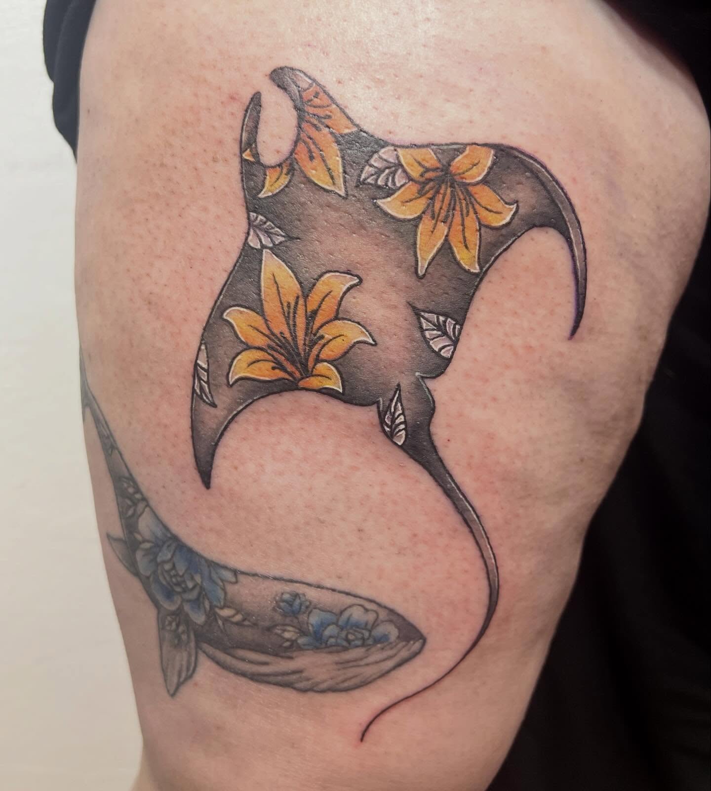 Ray with flowers new school tattoo on the shoulder by Amber Rose