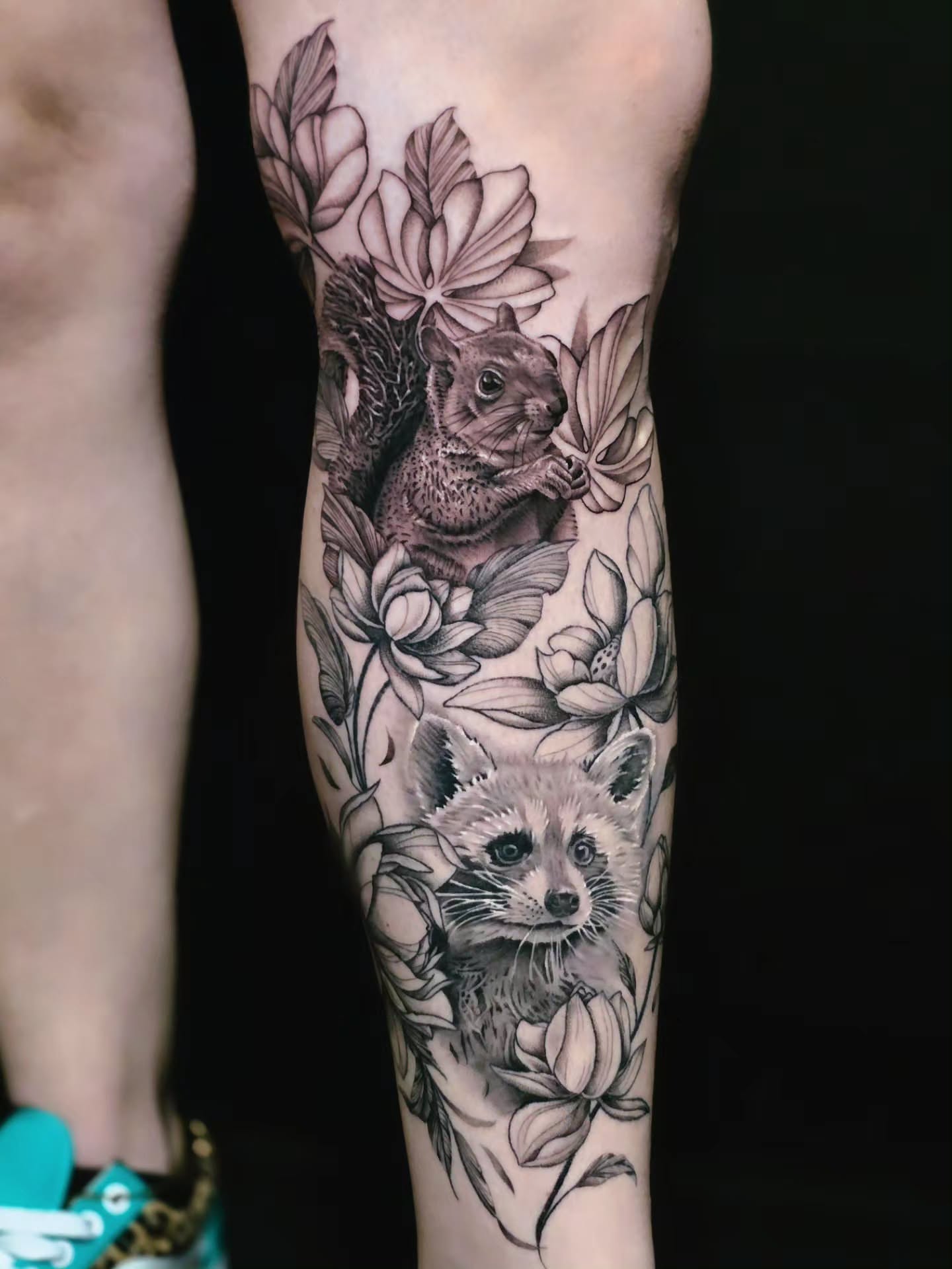 Squirrel and raccoon realism tattoo on the forearm by Jake Barney