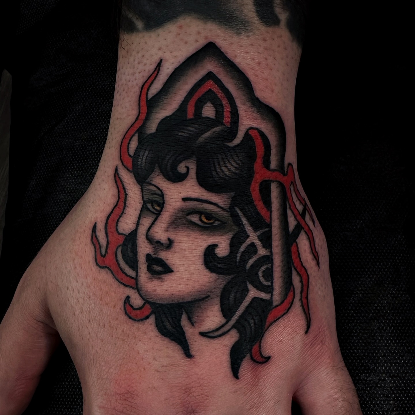 Woman's face dark realism tattoo on the hand by Brandon Murphy