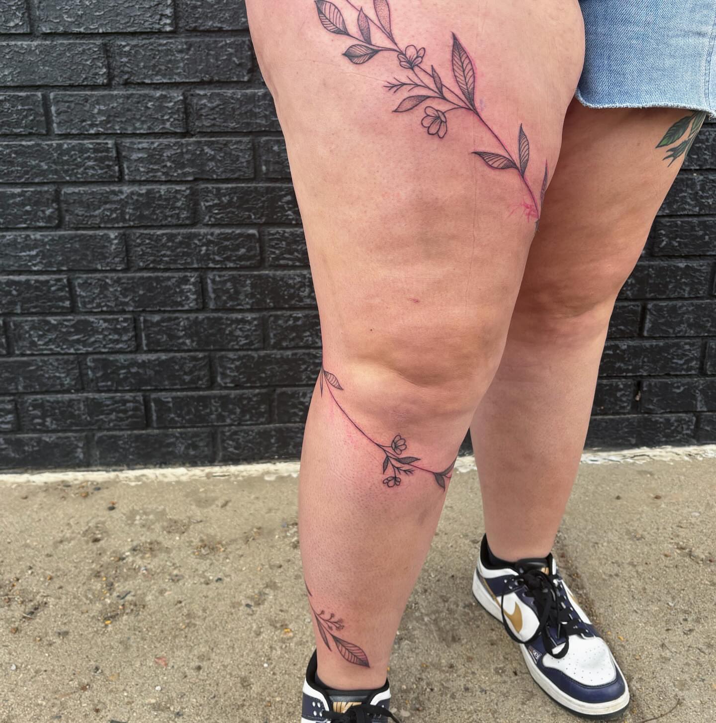Floral vine fine line tattoo on the thigh by Demi Flores 🖤