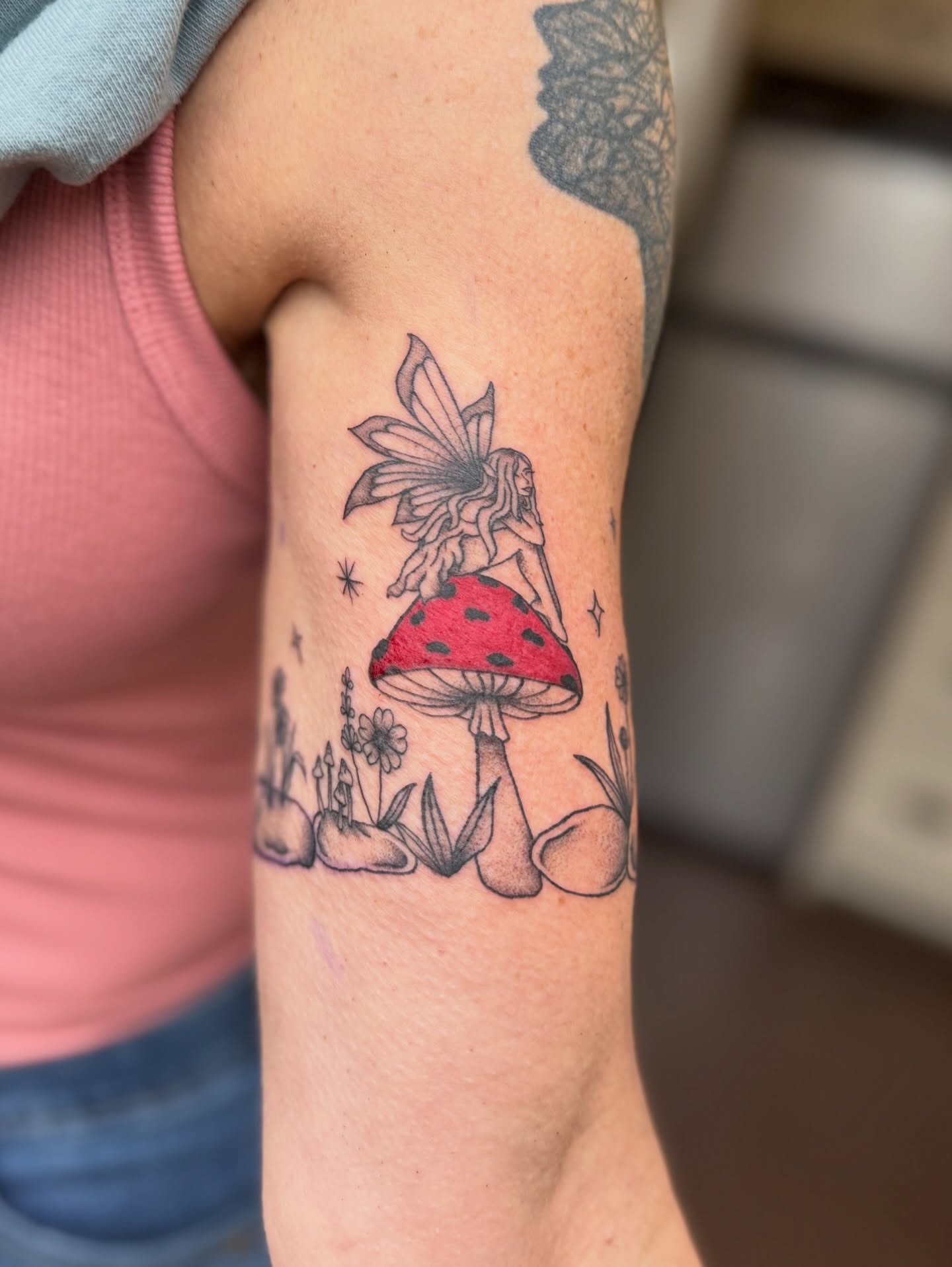 Fairy and mushroom dotwork tattoo on the forearm by Jenna Nicole