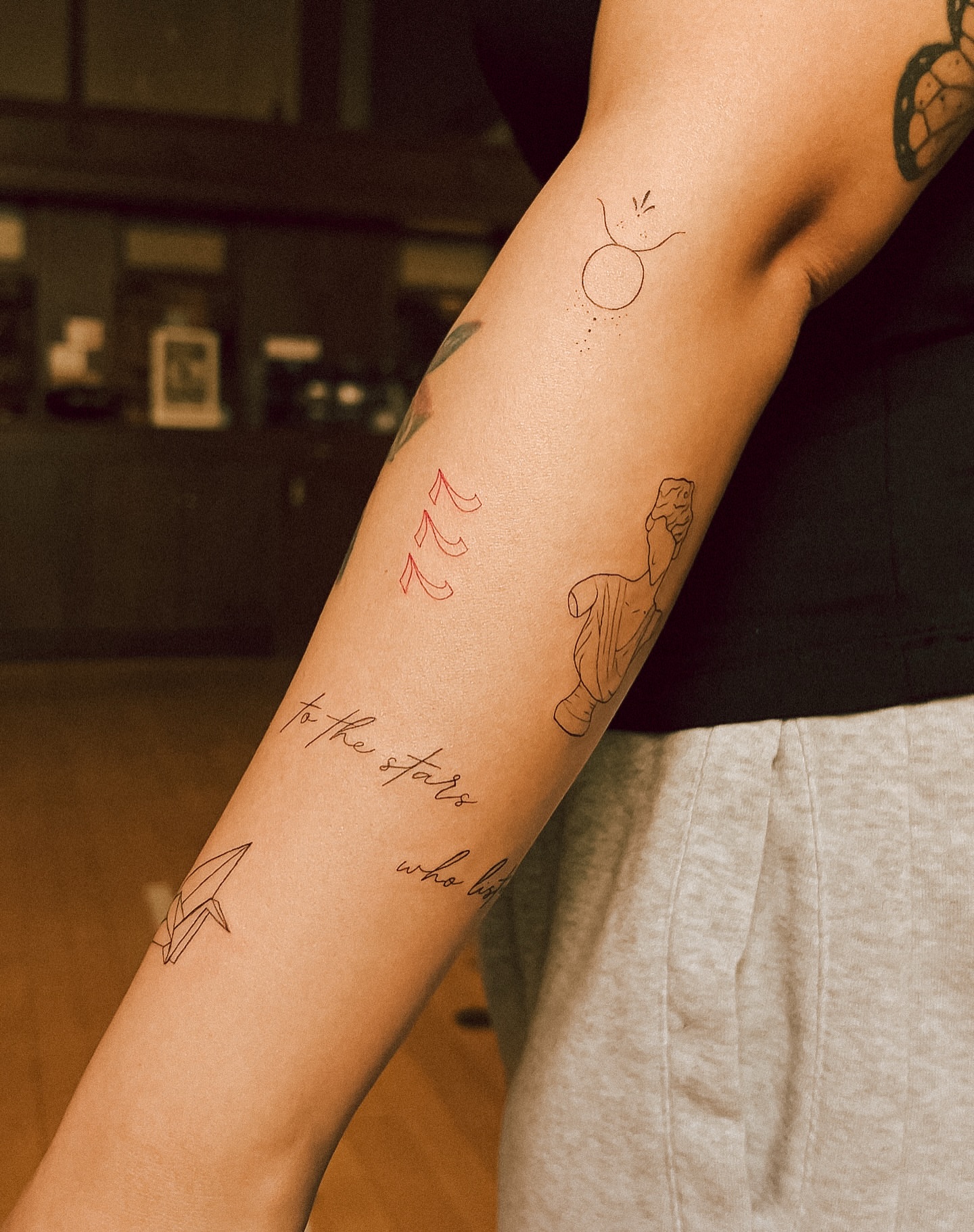 Rocket and celestial figures fine line tattoo on the forearm by chloe ☼, Tacoma, Washington