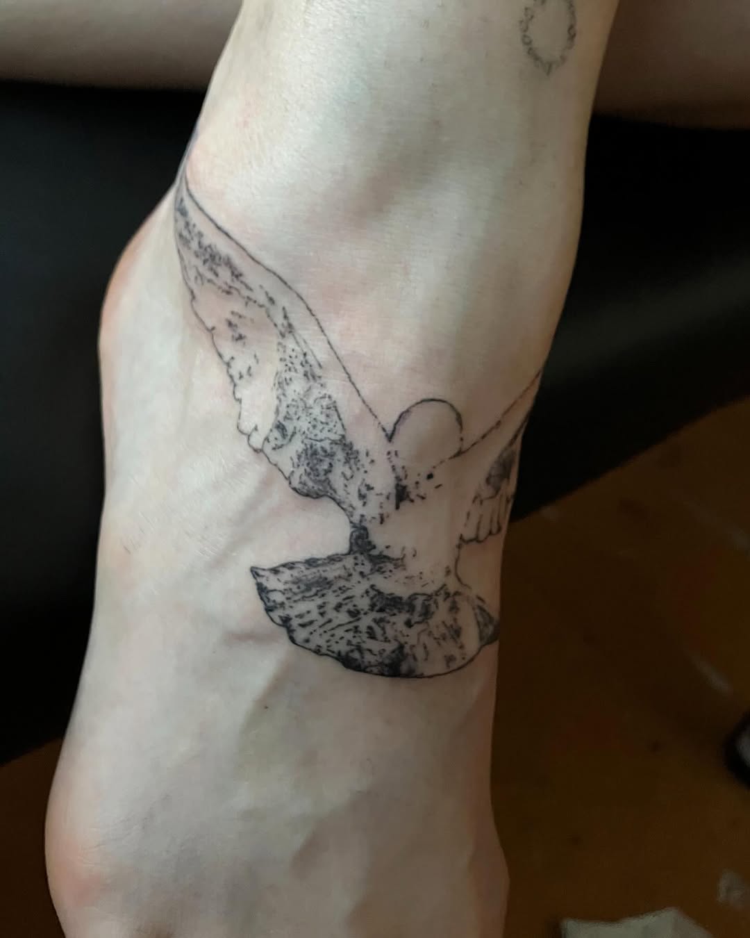 Dove fine line tattoo on the foot by Sashka