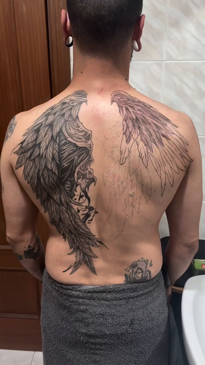 Angel wings tattoo realism tattoo on the back by Kunaytattoo
