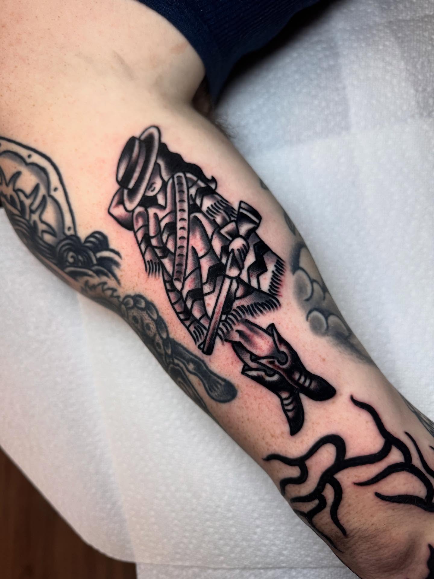 Mechanical figure black and grey tattoo on the forearm by Jonathan Clapp, San Antonio, Texas