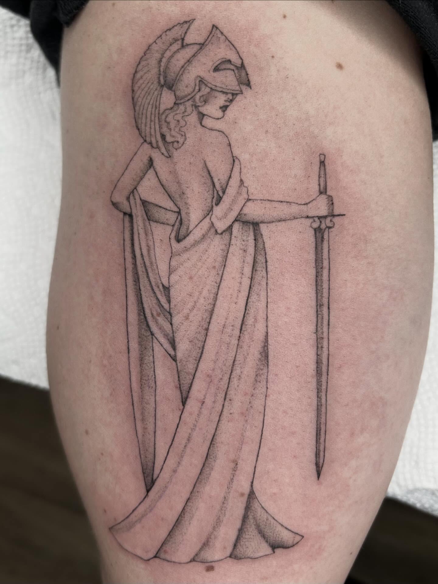 Greek warrior woman black and grey tattoo on the thigh by Olivia Fox