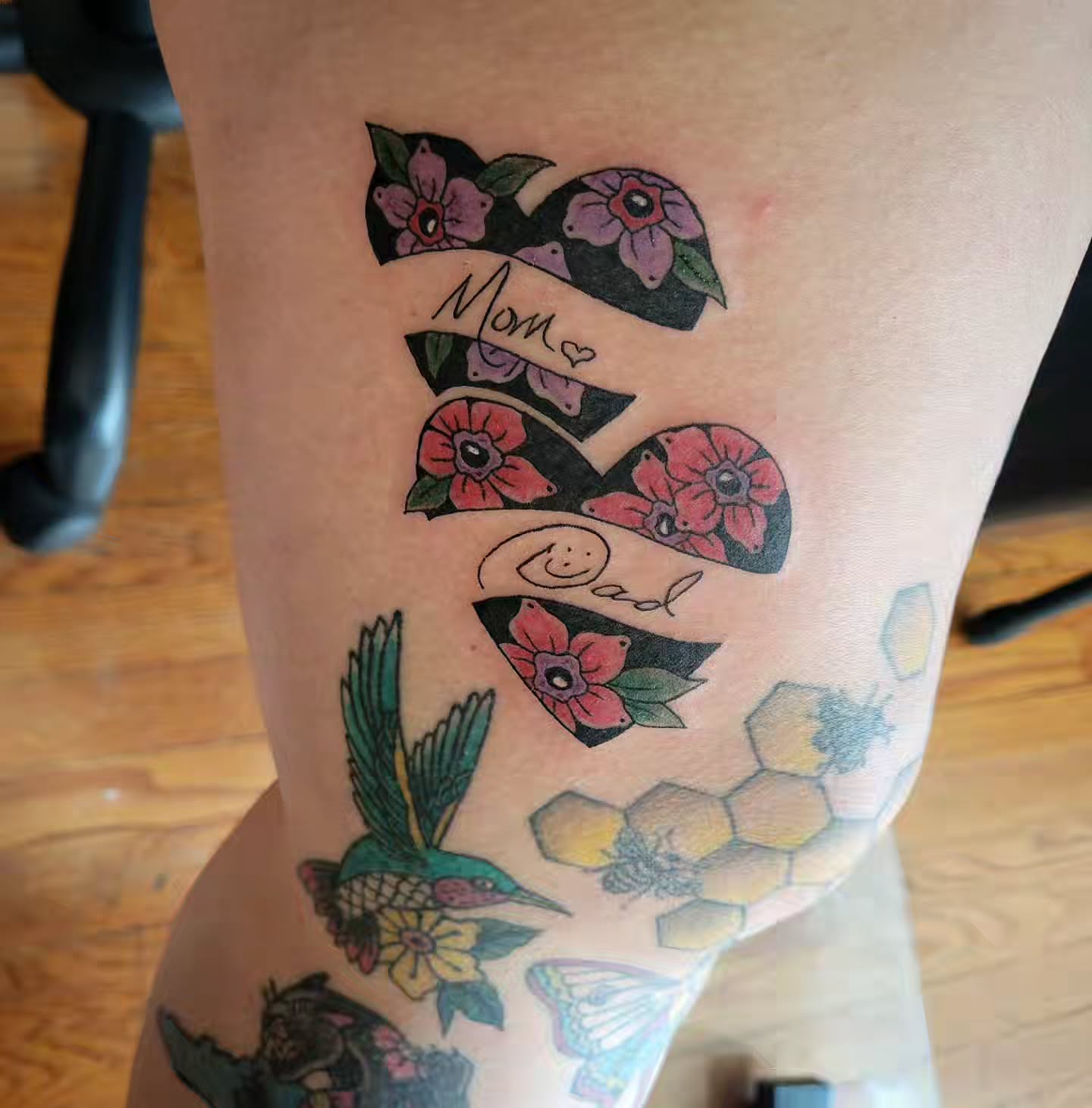 Infinity symbol and flowers American traditional tattoo on the thigh by Solstice Tattoos by Savannah Sadler (future, Salisbury, North Carolina