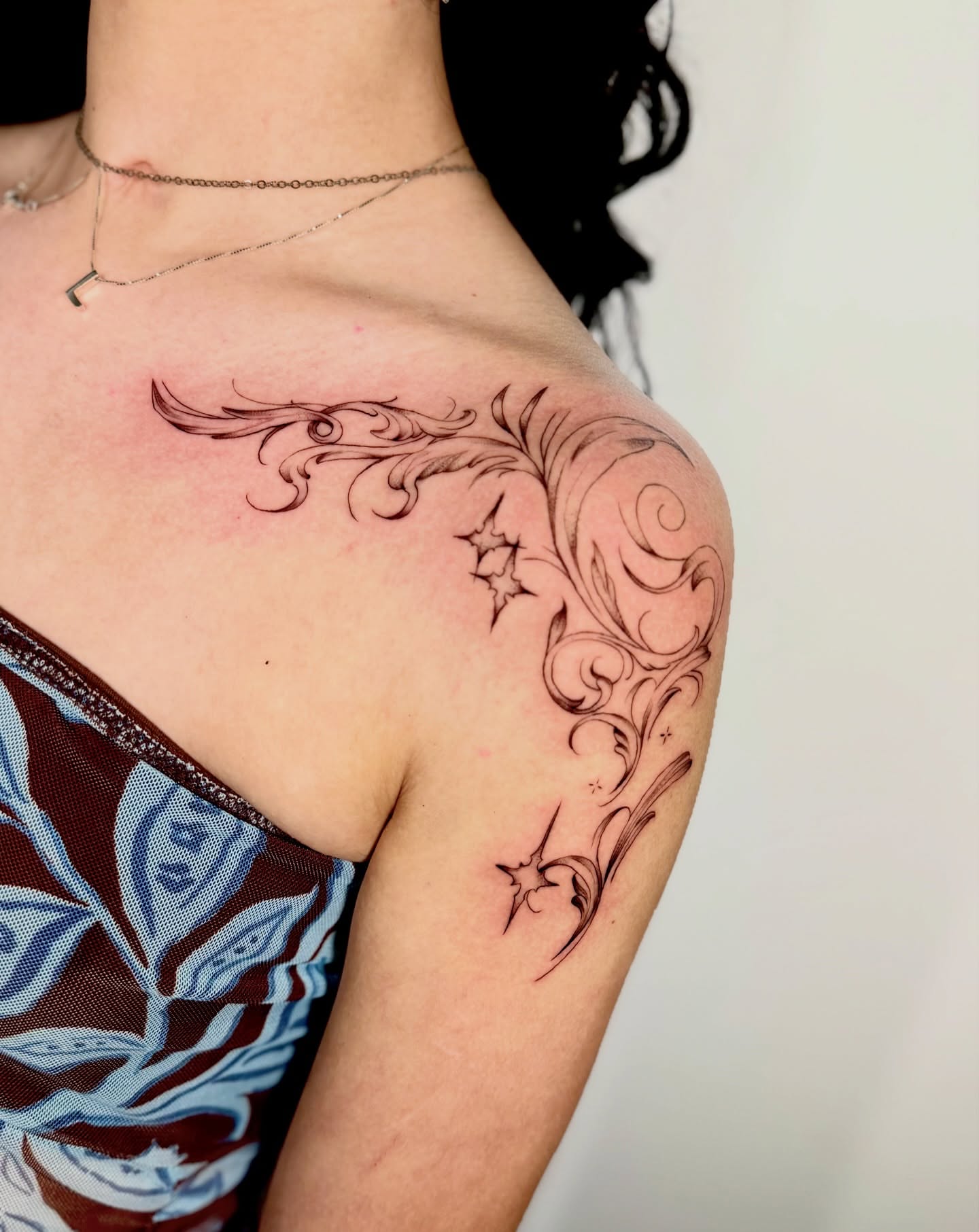 Floral ornament ornamental tattoo on the shoulder by Orca