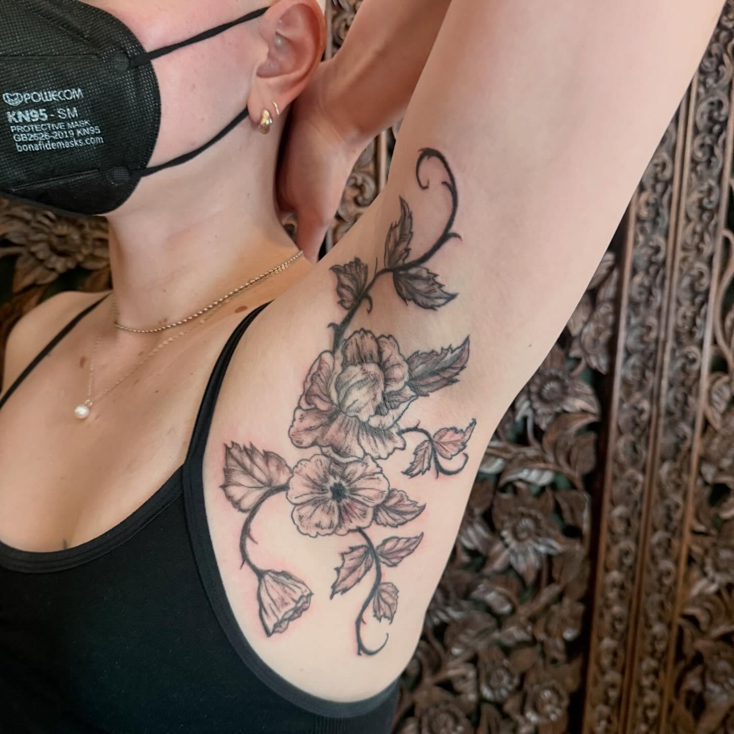 Floral vine black and grey tattoo on the forearm by Emily Rose Lumsdaine