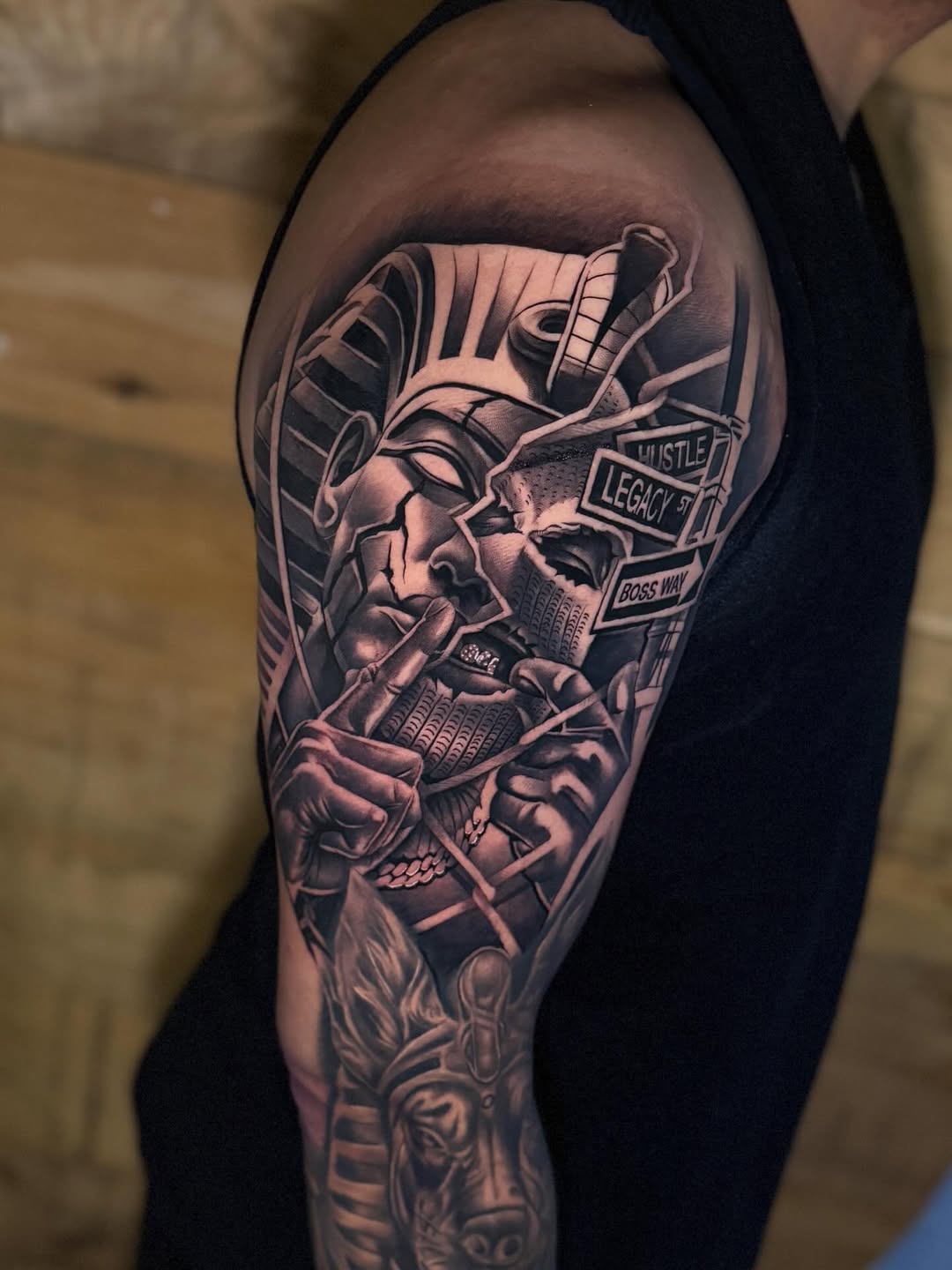 Realism tattoo on the upper arm by Miles Johnson