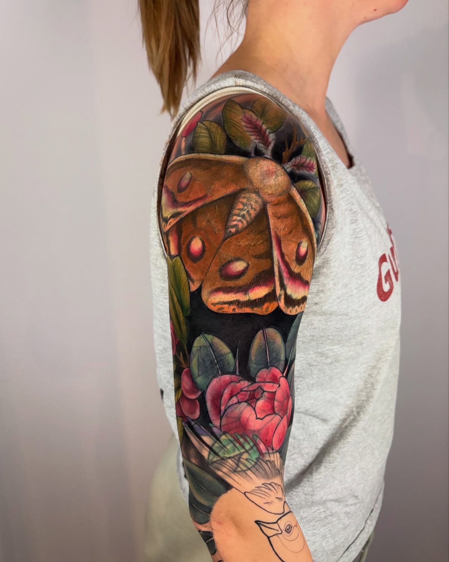 Butterfly and flowers realism tattoo on the upper arm by π―πππππ