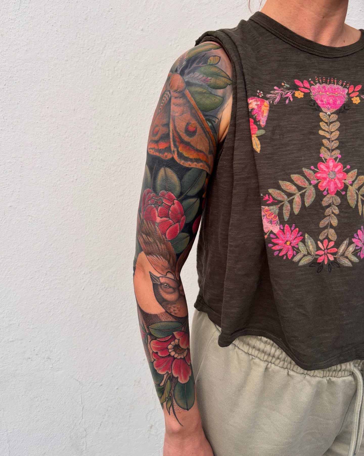 Butterfly and flowers American traditional tattoo on the upper arm by π―πππππ