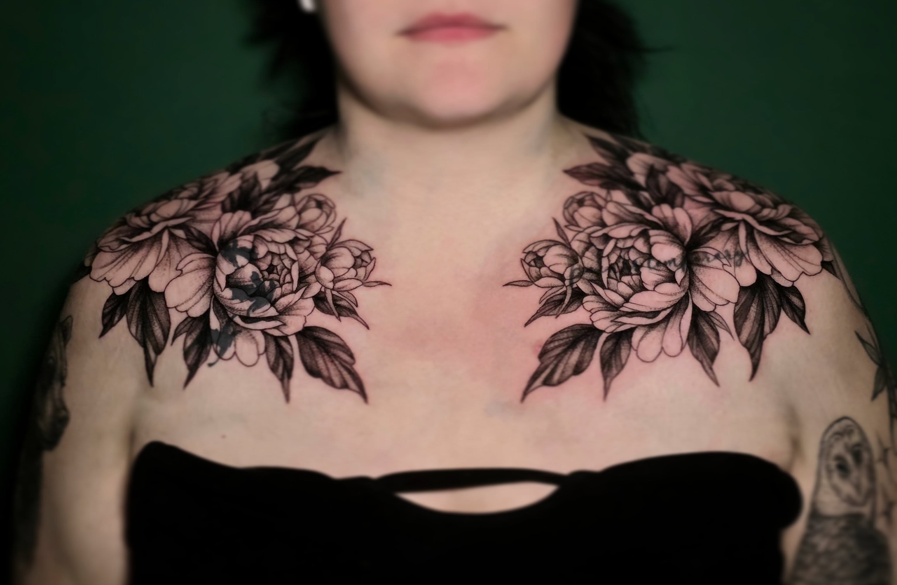 Peony flowers black and grey tattoo on the chest by Nick de Hoyos
