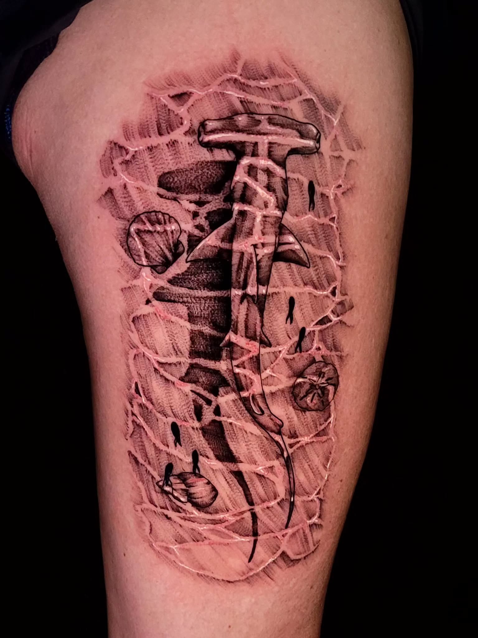 Hammer black and grey tattoo on the thigh by Tyler Monty