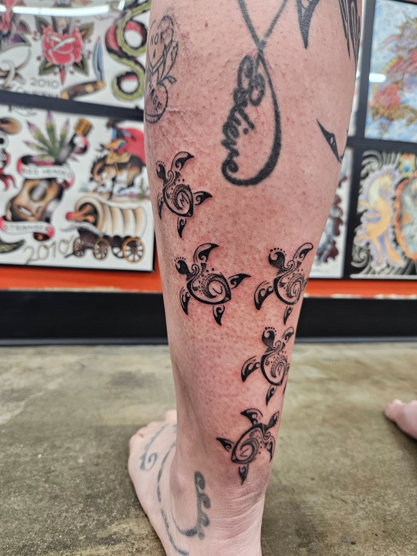 Sea turtles tribal tattoo on the calf by MK Stevens - Greeley Based Tattoo Artist