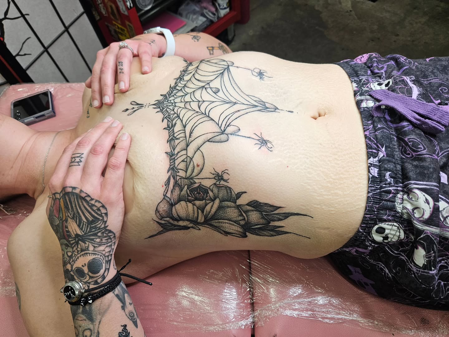 Spider web and roses dark realism tattoo on the torso by MK Stevens - Greeley Based Tattoo Artist