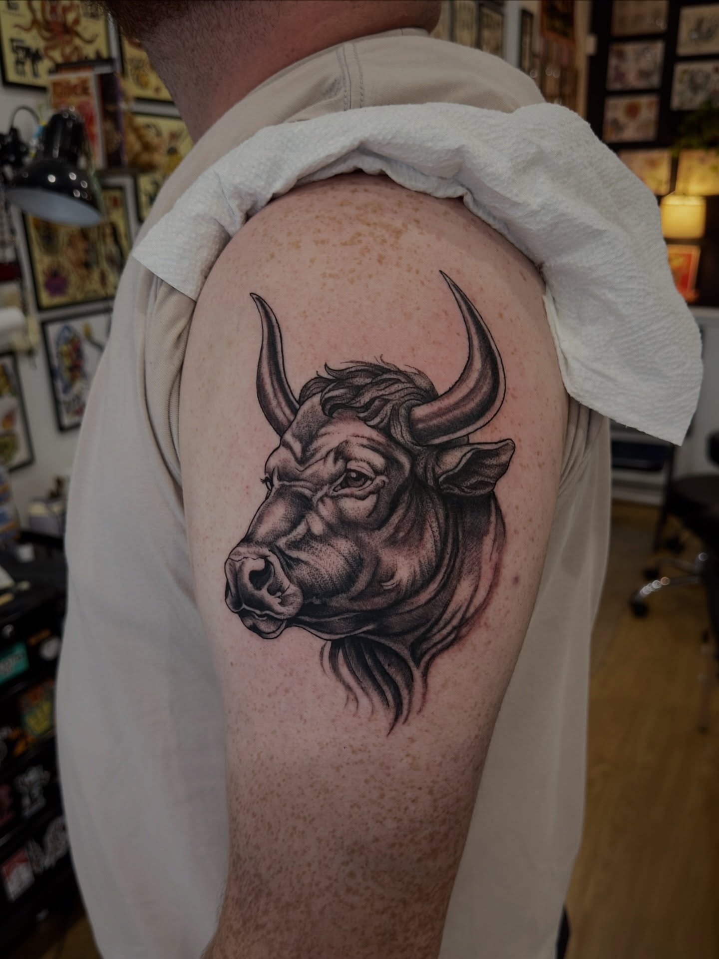 Bull head realism tattoo on the shoulder by Matt Kearney