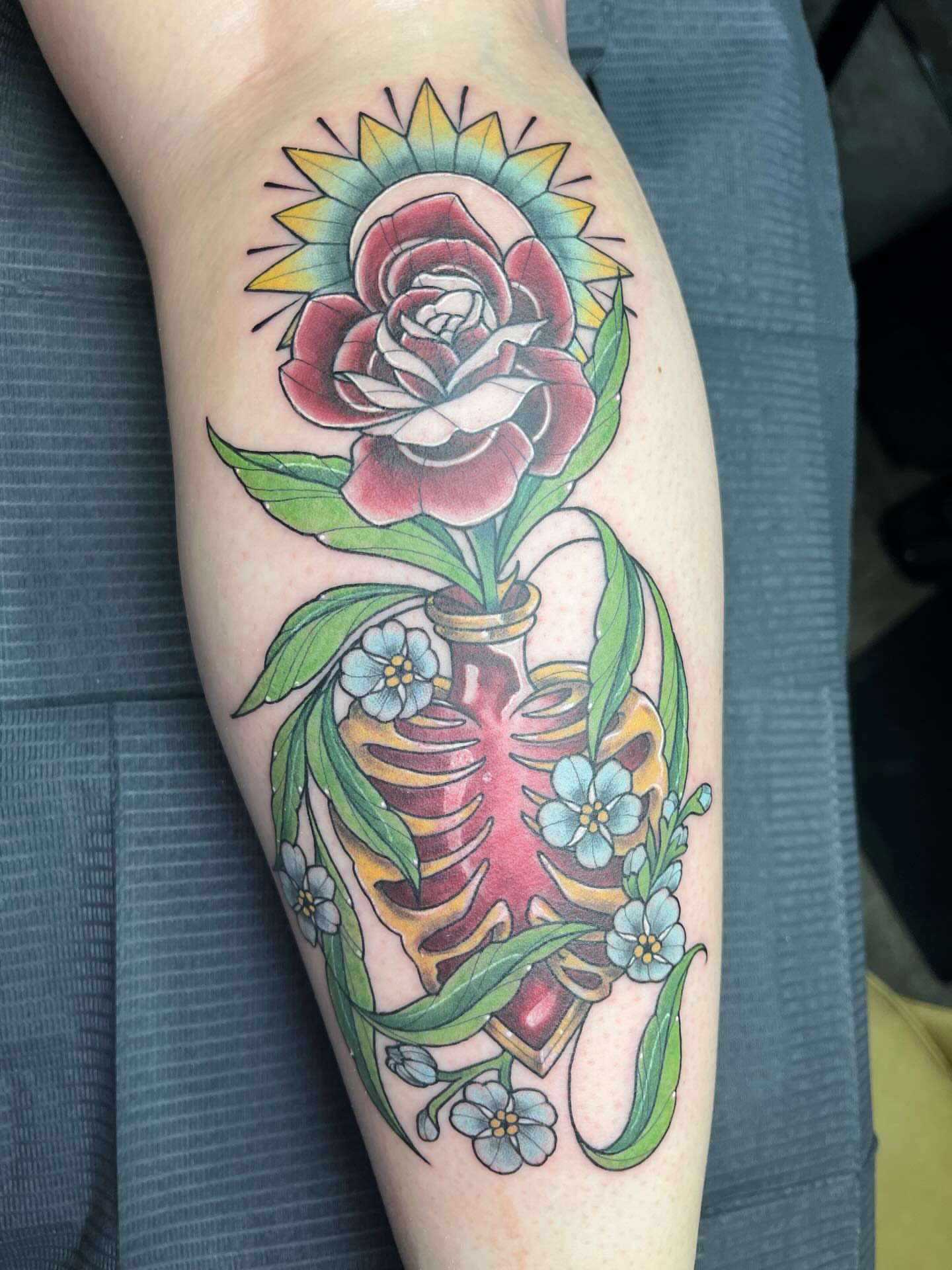 Flower in ribcage American traditional tattoo on the forearm by Michigan Tattoo Artist - Nadia Garver, Clinton Township, Michigan
