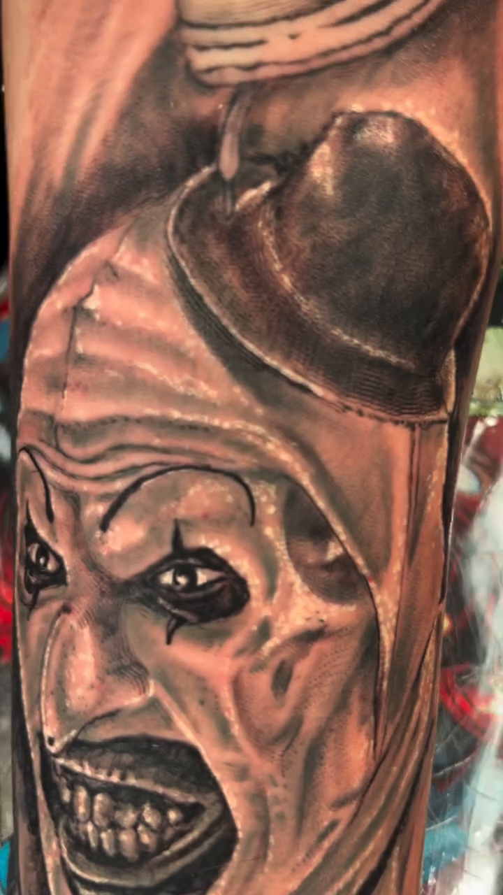 Art the Clown portrait realism tattoo on the forearm by Jakobi