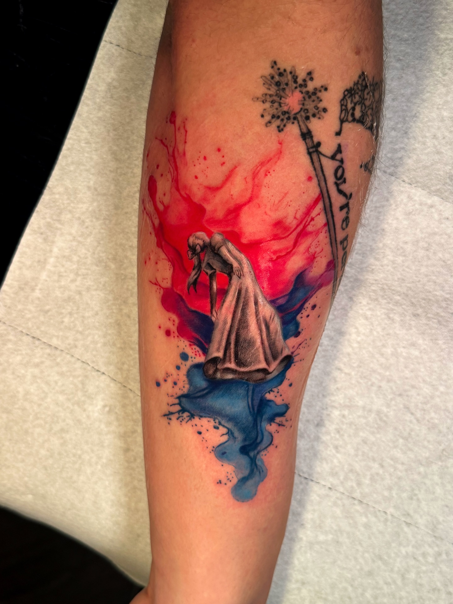Woman in dress watercolor tattoo on the forearm by Ericka Hampton, Ferndale, Michigan
