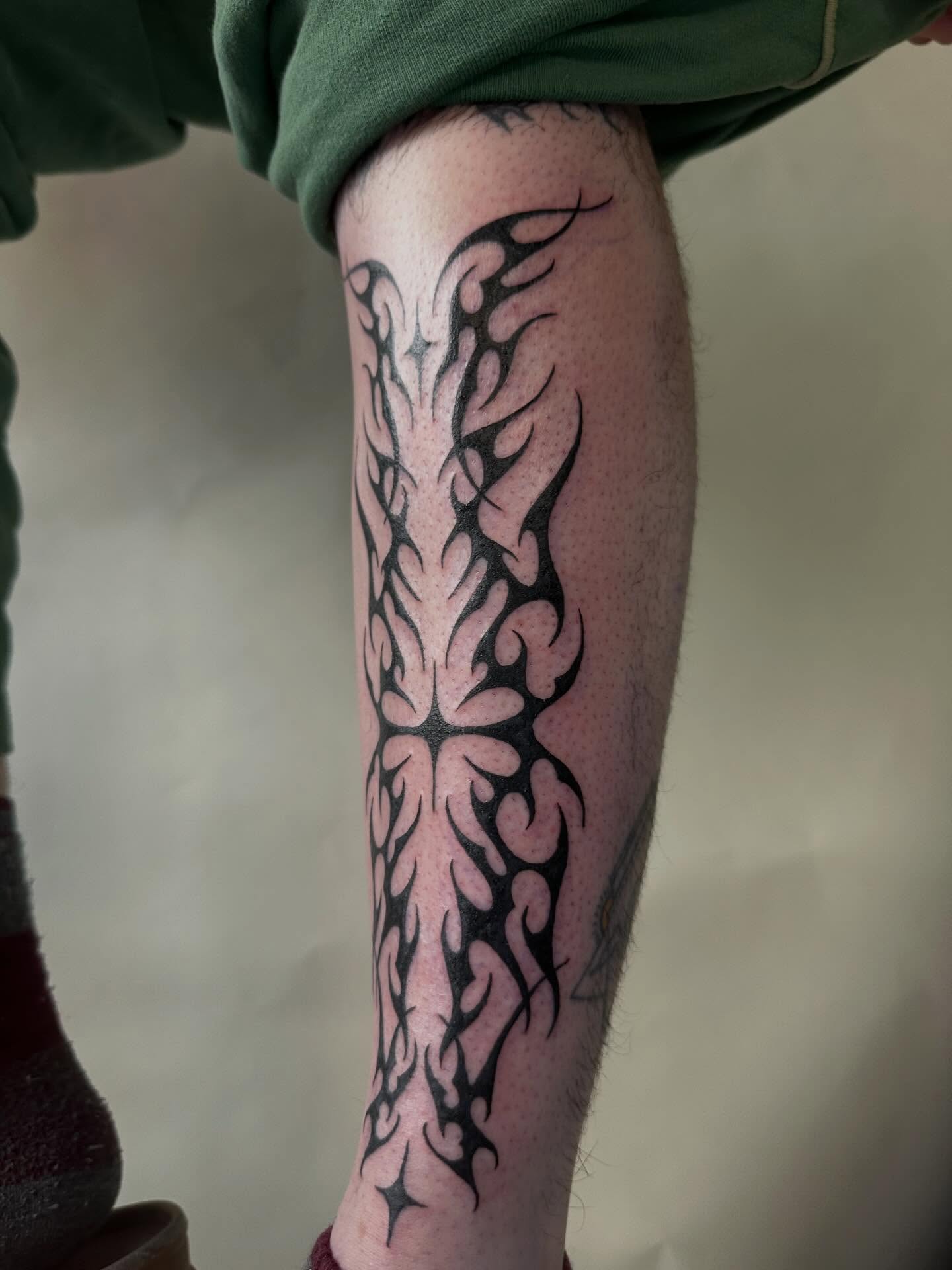 Flame tribal tattoo on the calf by 𝔠𝔞𝔯𝔯𝔦𝔢