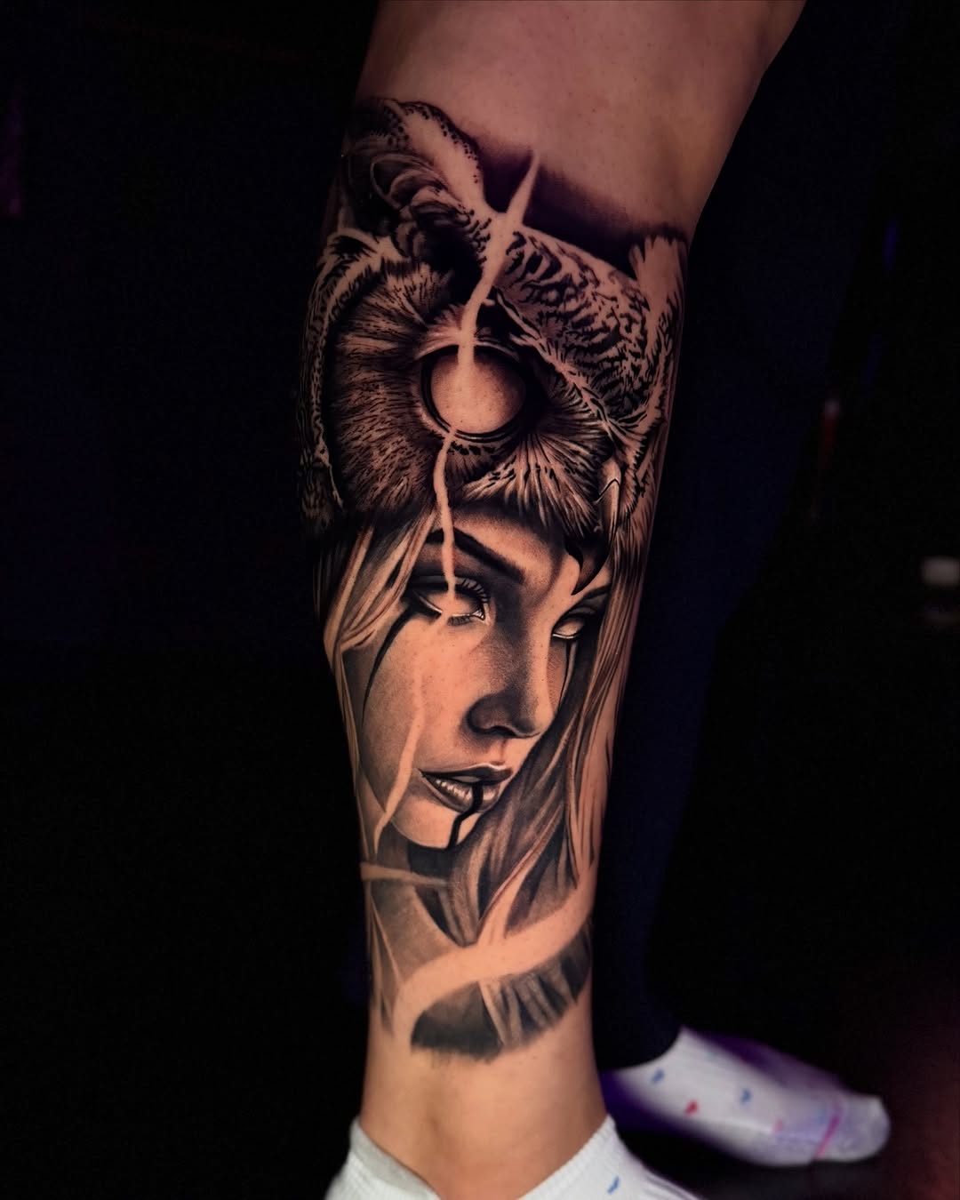 Woman with owl headdress realism tattoo on the forearm by Tommy Nguyen, Eastpointe, Michigan
