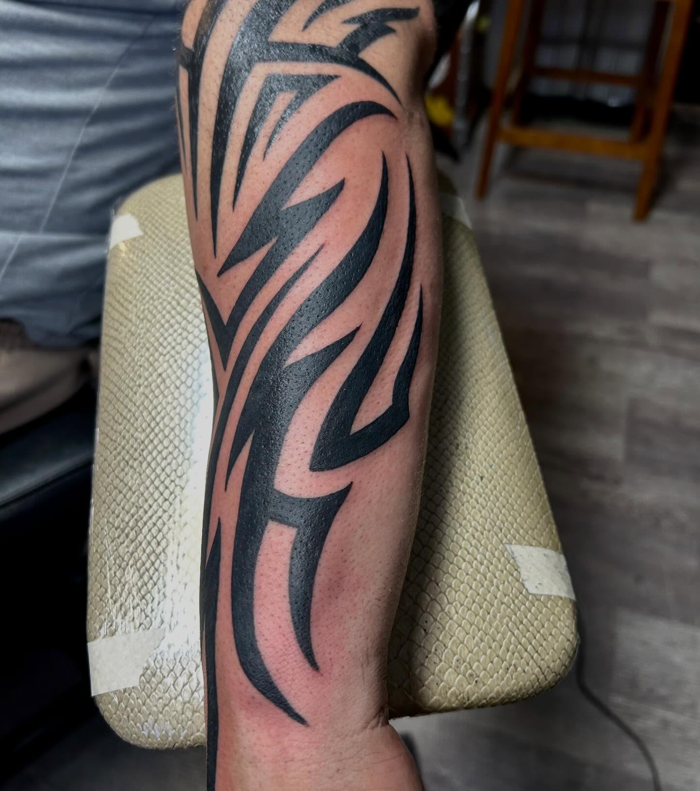 Tribal lightning bolt tribal tattoo on the forearm by darklord_666