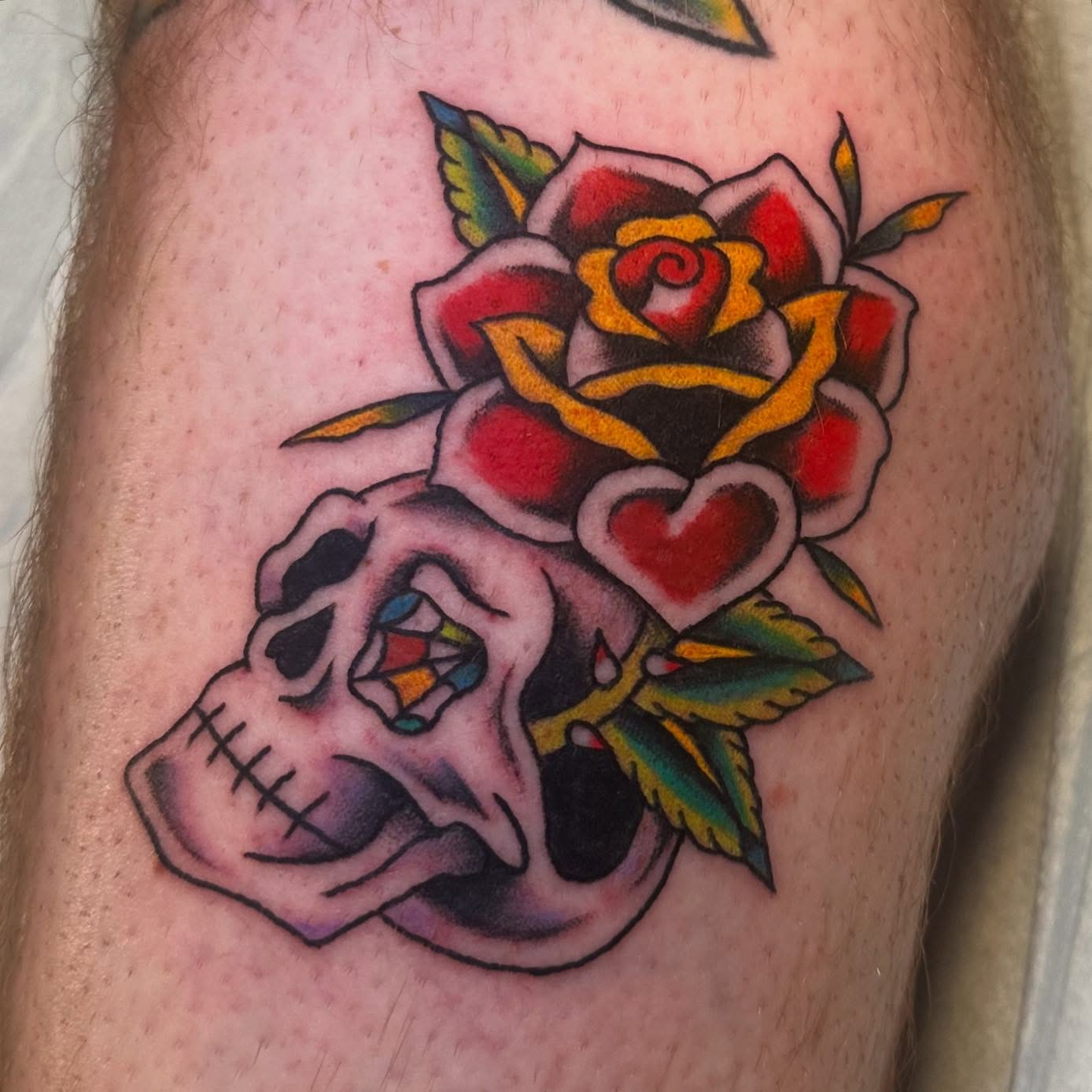 Skull and rose American traditional tattoo on the thigh by ࿊ Emma Sloan Tattoos ࿊, Austin, Texas
