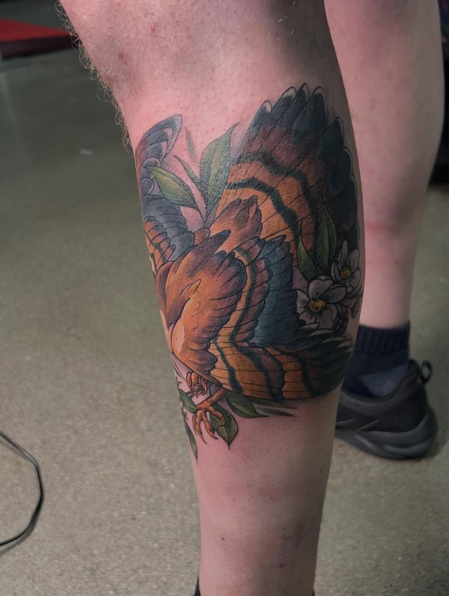 Bird and flowers American traditional tattoo on the thigh by Bailey Goodwin, Ankeny, Iowa