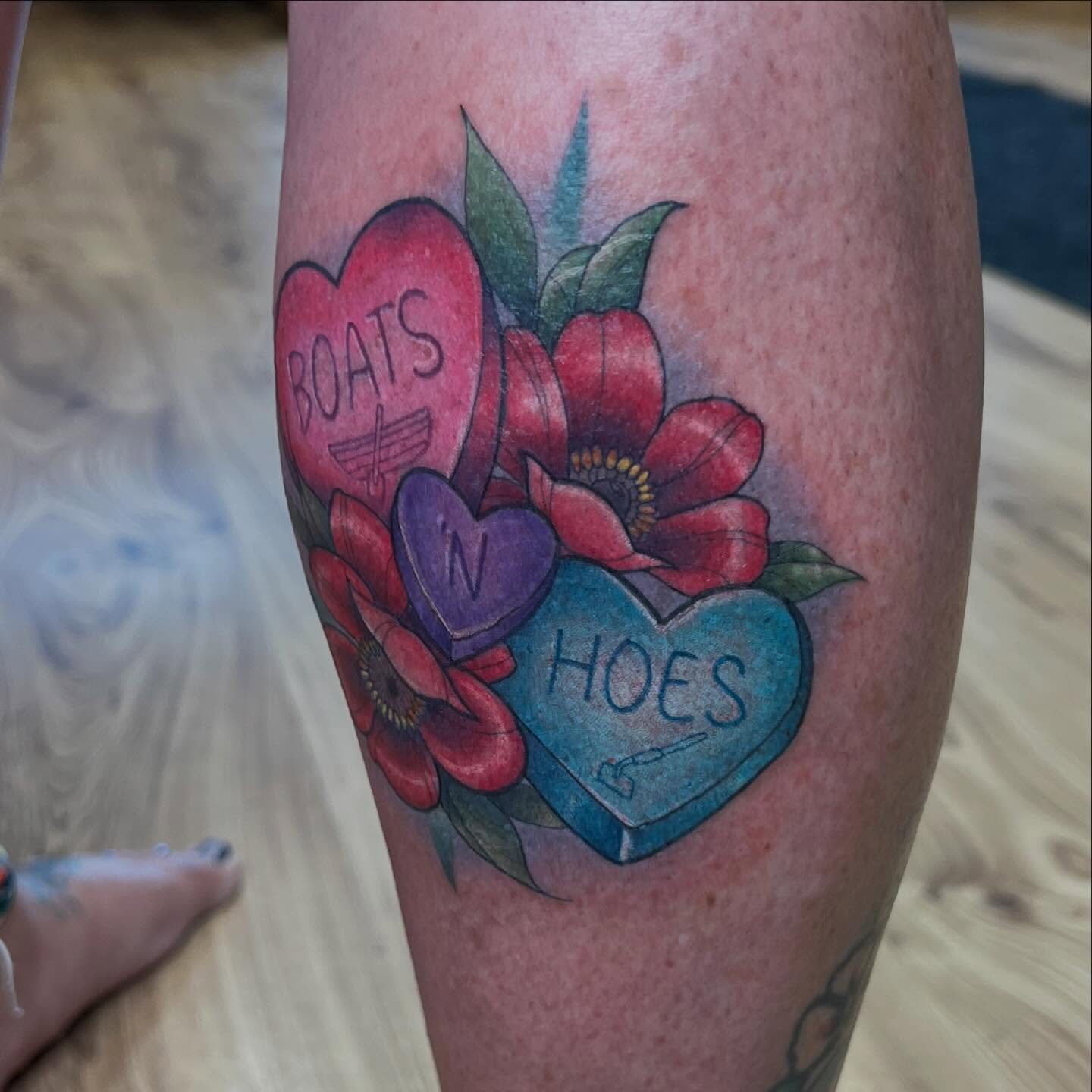 Heart candies American traditional tattoo on the forearm by Bailey Goodwin, Ankeny, Iowa