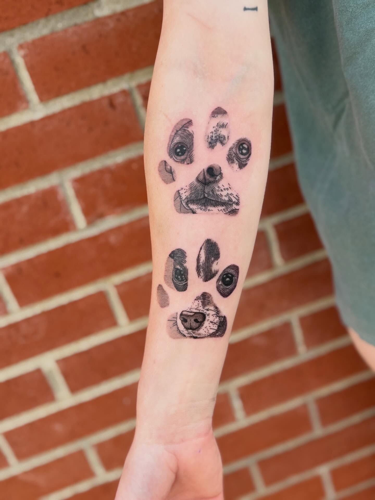 Dog face and paw prints realism tattoo on the forearm by Aly Rucker, Murfreesboro, Tennessee
