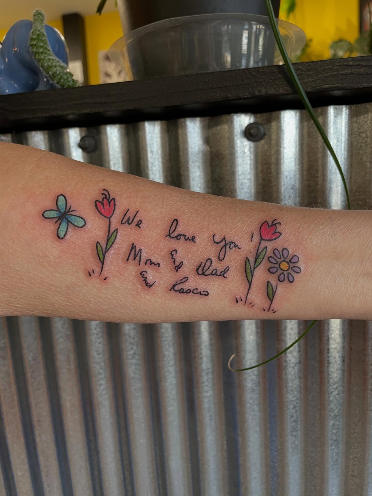 Love message lettering script tattoo on the forearm by Mallory Moore