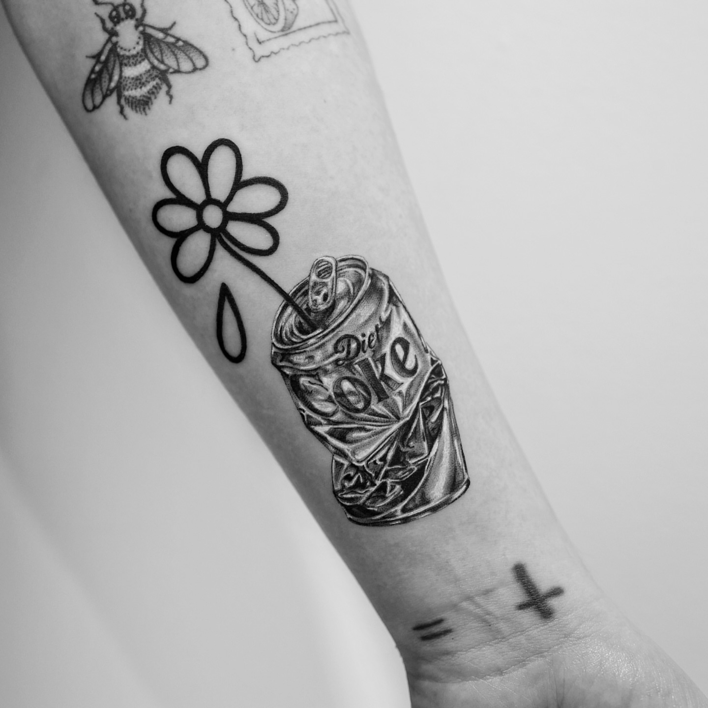 Diet coke can black and grey tattoo on the forearm by Ross Clark Tattoos