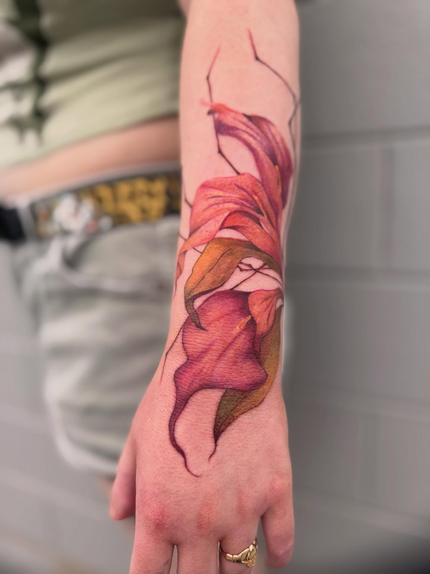Lily realism tattoo on the forearm by Cohen