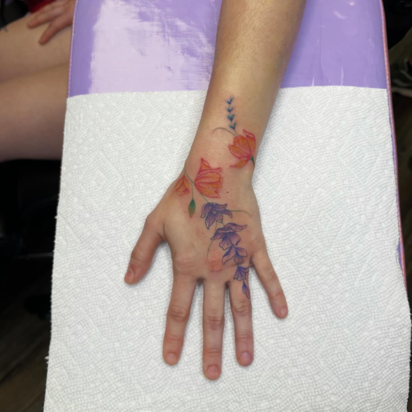 Floral arrangement watercolor tattoo on the hand by Ebony Robinson, Austintown, Ohio