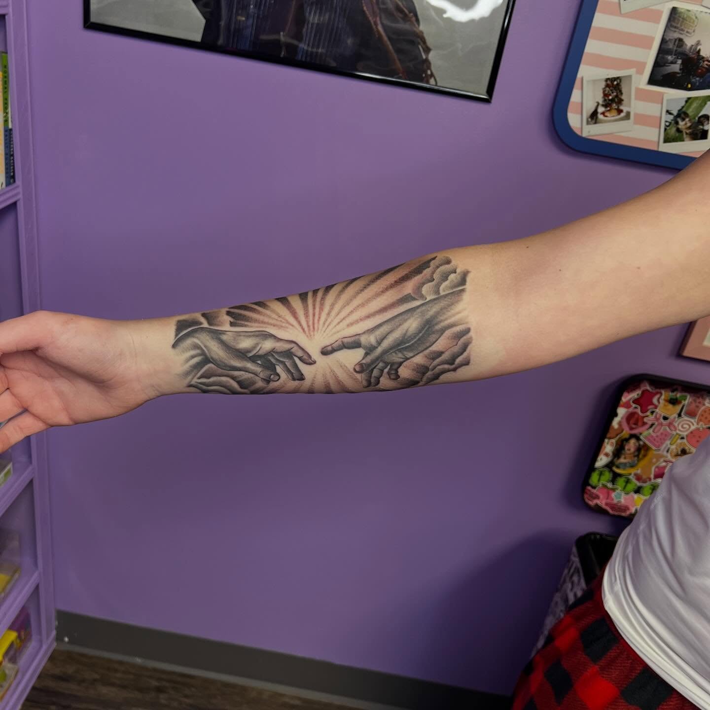 Creation hands realism tattoo on the forearm by Ebony Robinson, Austintown, Ohio