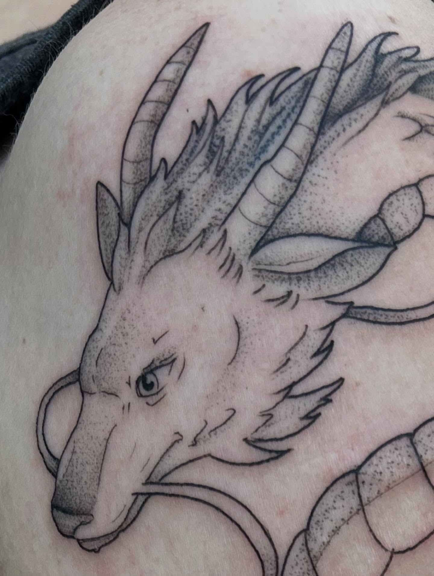 Dragon dotwork tattoo on the shoulder by Mayhem Andrews