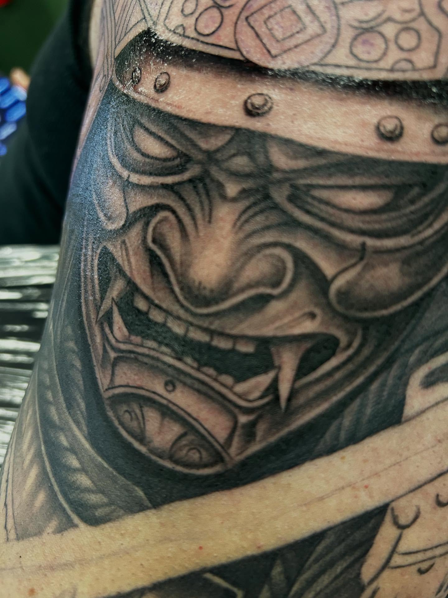 Mask realism tattoo on the forearm by Mayhem Andrews