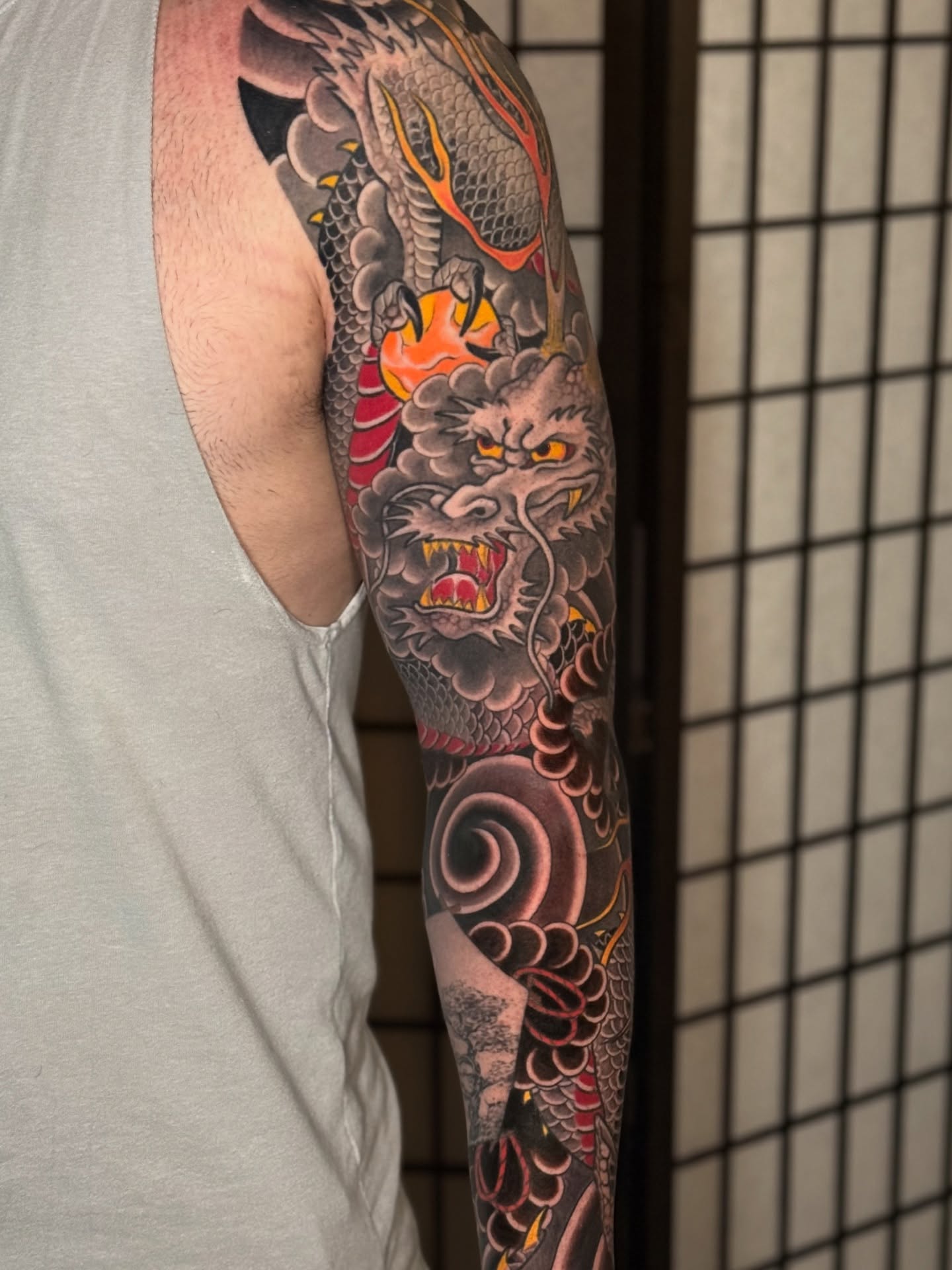 Dragon japanese irezumi tattoo on the upper arm by Mario Arcila