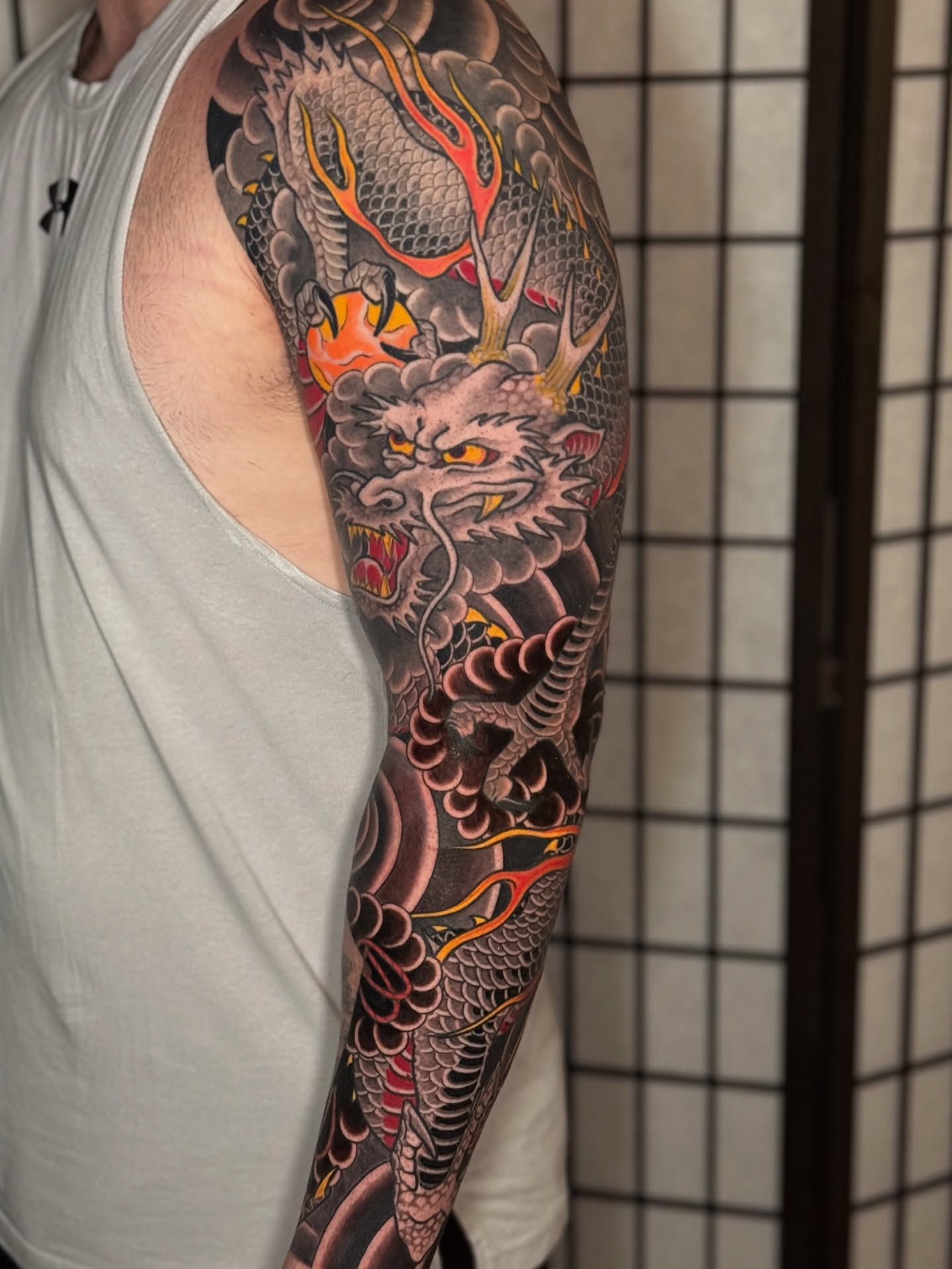 Dragon japanese irezumi tattoo on the upper arm by Mario Arcila