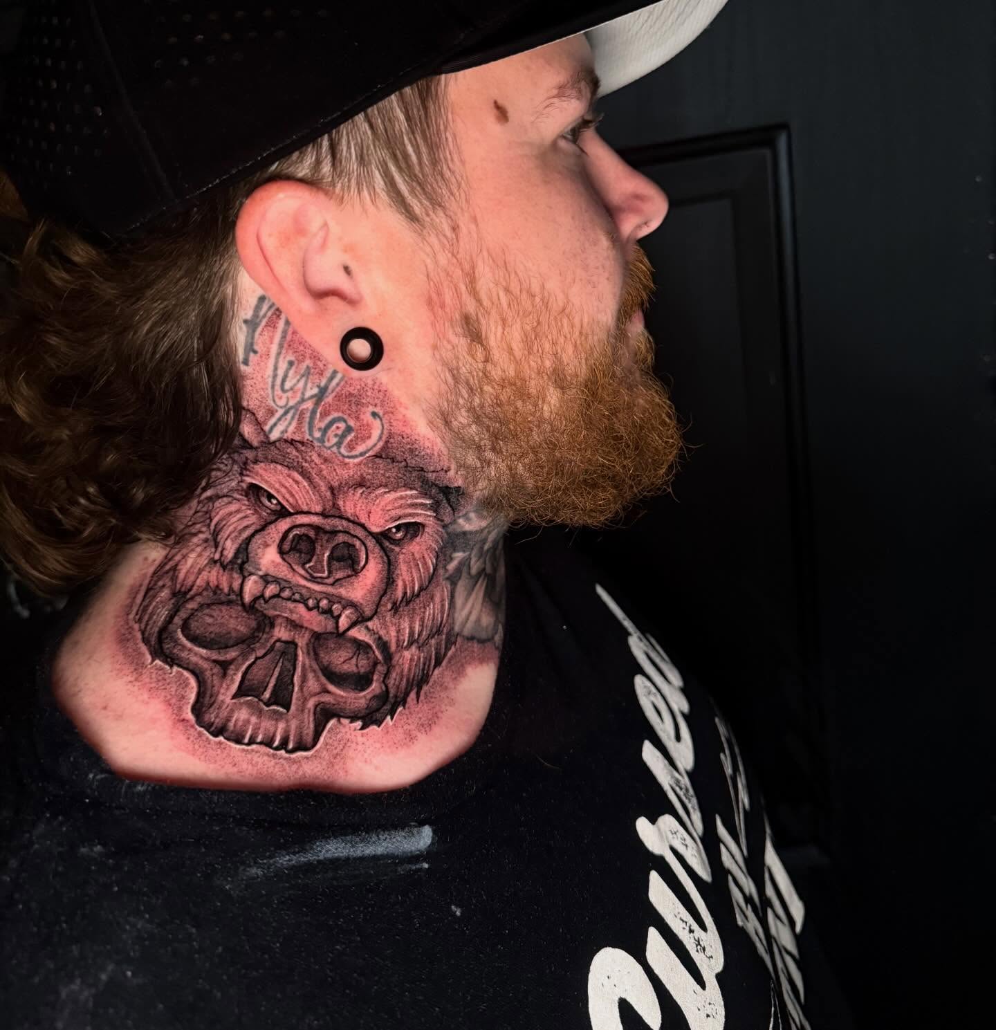 Bear realism tattoo on the neck by Alex Wheelock