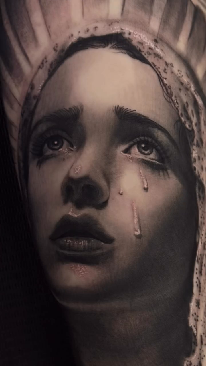 A crying woman's portrait realism tattoo on the forearm by Nance⚡