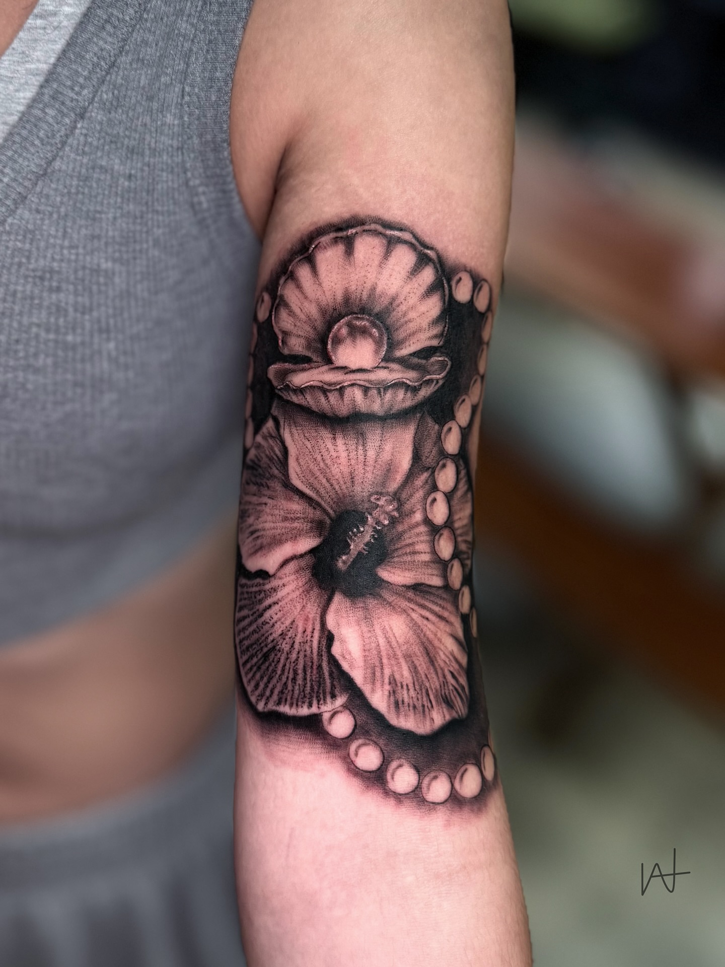 Octopus and flower realism tattoo on the forearm by Kat Parmu