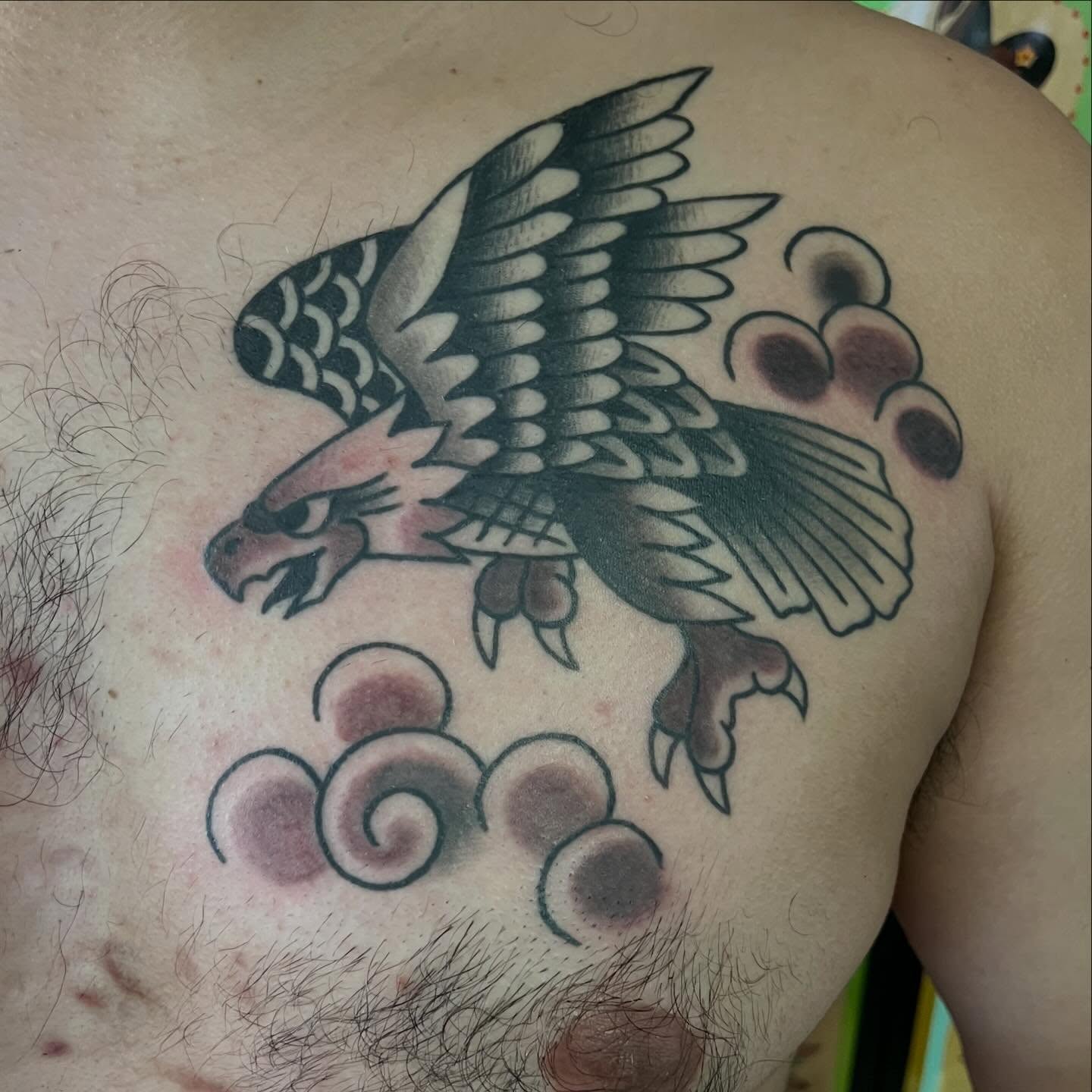 Eagle American traditional tattoo on the chest by Mikey Montoya