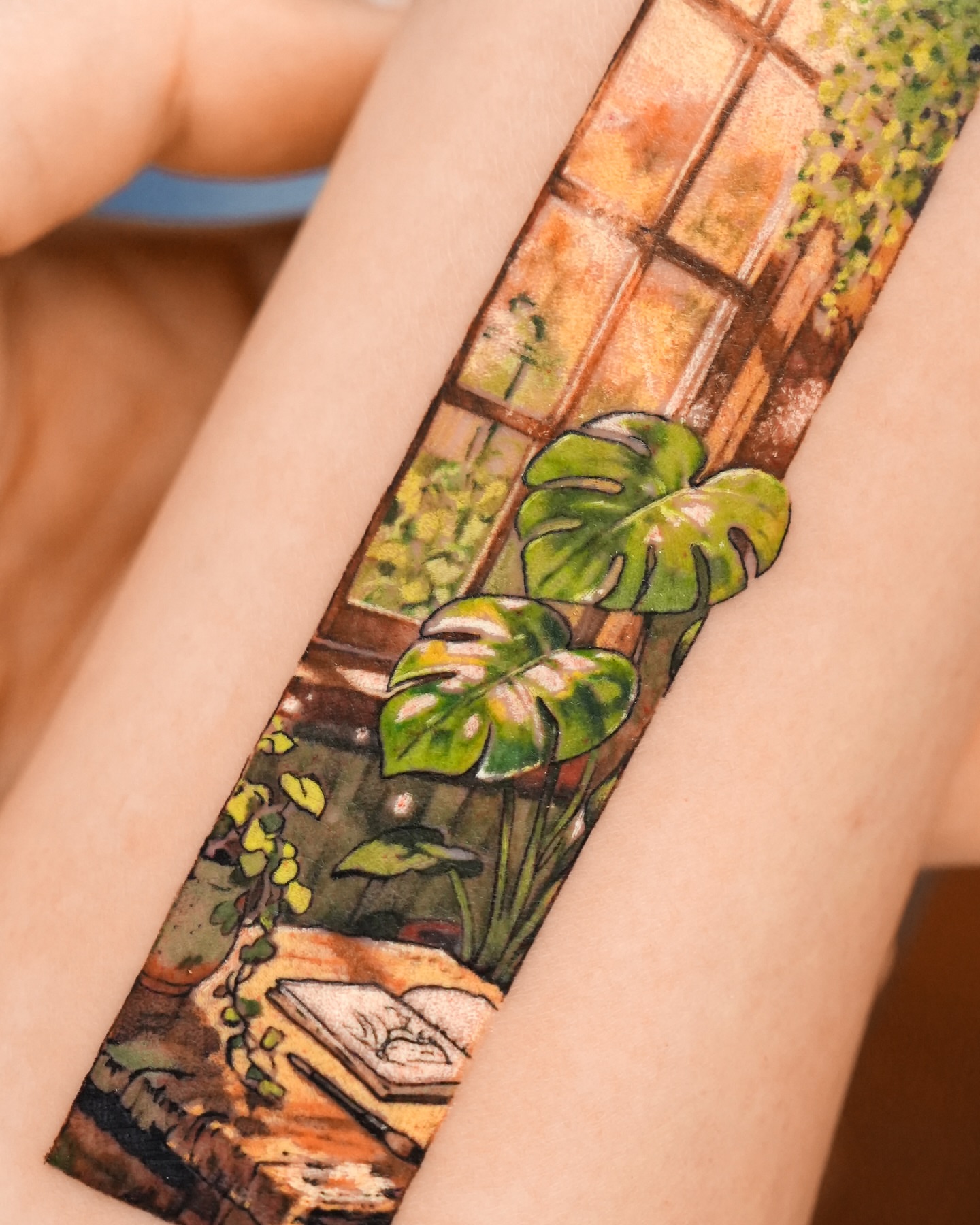 Monstera plant watercolor tattoo on the forearm by YUN