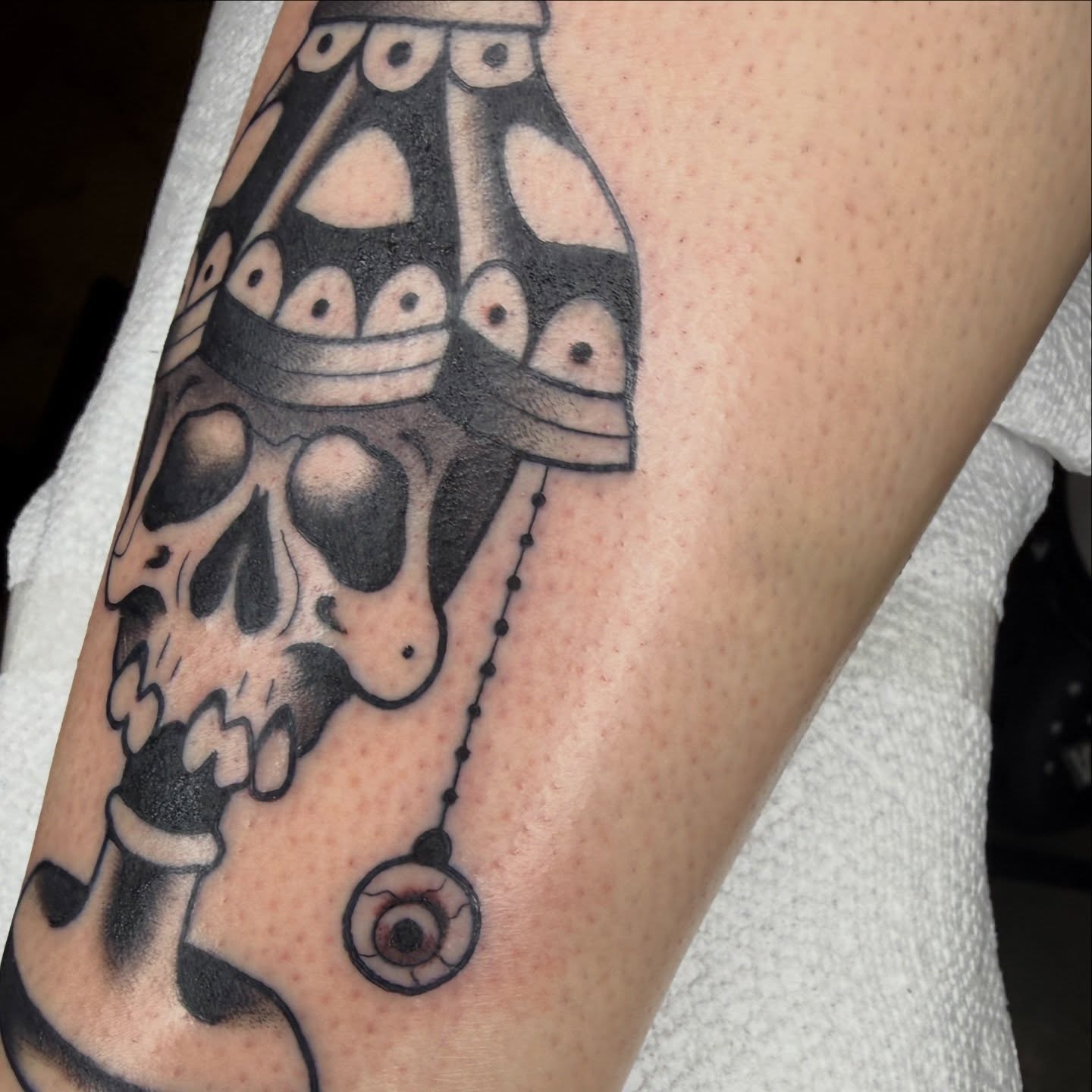 Skull with ornate headdress geometric tattoo on the forearm by @chrisskon, Carpentersville, Illinois